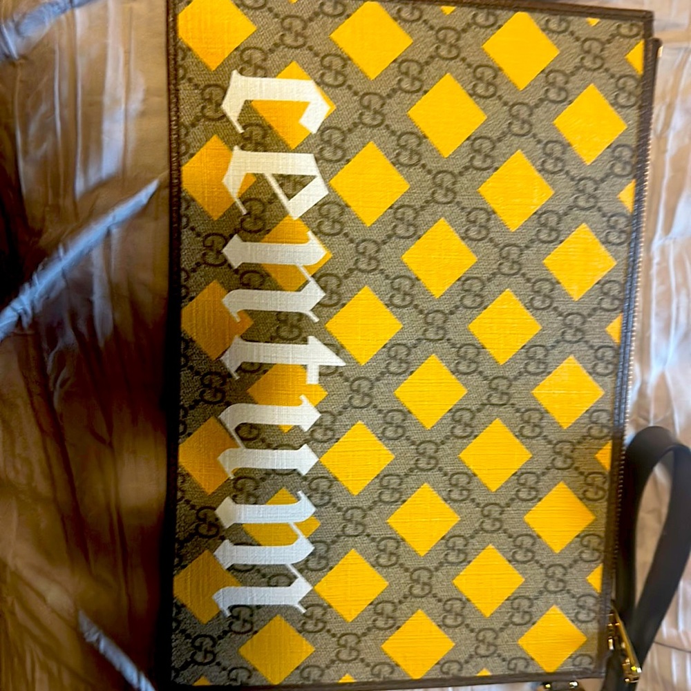 Large authentic Gucci clutch new and comes with dust cover